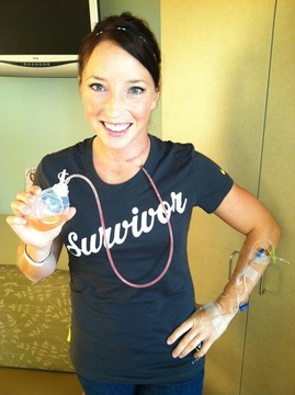 Shannon poses after her second surgery to remove 30 infected lymph nodes from the left side of her neck. 
