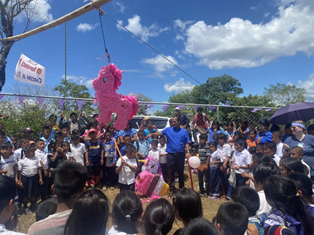 Kids playing with piñata