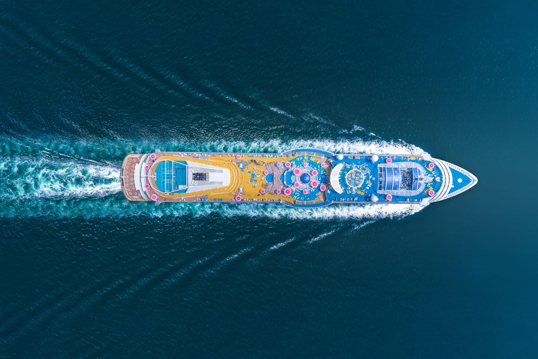 overhead view of cruise ship in water and the benefits of travel insurance